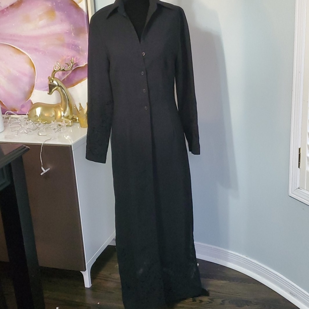 Full length black lightweight overcoat.